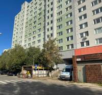 Apartment building on Strečnianska Street in Bratislava-Petržalka next to the parking lot.