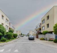 Agátová Street in Rovinka with a rainbow over the 2-bedroom apartments on both sides.