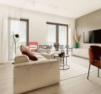 A bright living room in a 3-room apartment with comfortable seating and a TV on the wall.