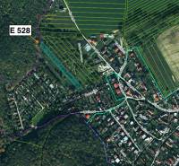 Aerial view of agricultural and forest lands in the village of Sokoľ with marked parcels.