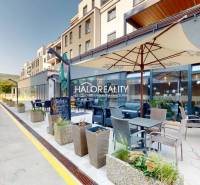 Gastro premises in BA - Nové Mesto, outdoor seating, umbrella, and modern apartment buildings.