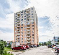 A high-rise building with a parking lot on 1. mája Street in Pezinok offers a view of a 3-room apartment.