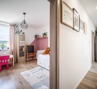 Children's room in a 3-room apartment with a bright interior, a desk, and toys.