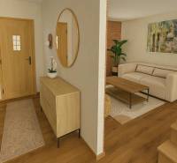 Hallway with wooden flooring, a mirror, and a plant next to the living room in a family house.