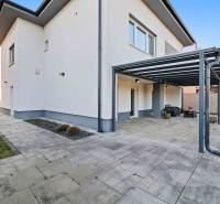 On Pluhová Street, there is a family house with a terrace and a garden by the house.