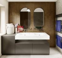 A bathroom in a 4-room apartment with a modern double sink and blue towels.
