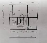 Floor plan of a 3-room apartment with a shown kitchen, bathroom, and loggia.
