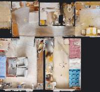 The floor plan of a 2-room apartment shows rooms with furniture and the arrangement of the spaces.