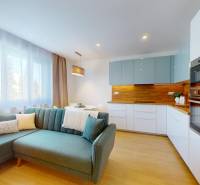 Living space with a kitchen unit and a sofa, 3-room apartment.
