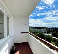 A balcony with a view of the rooftops of the Old Town in Bratislava, a 3-room apartment on Bartókova.