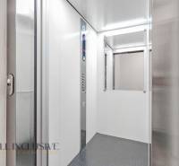 The interior of an elevator with lighting and a control panel in a 2-room apartment.