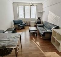 Living room with a sofa set and a table in a 2-room apartment.