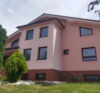A family house on Pršianska Terrace in Banská Bystrica surrounded by greenery and lawn.
