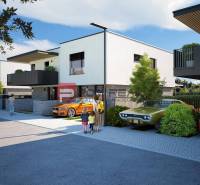 Newly built 3-room apartments in Dubová, surrounded by cars and cyclists in sunny weather.