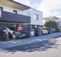 A street with stylish houses and cars in Dubová, ideal for residents of 3-room apartments.