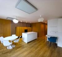 Kitchen in a family house with a dining table and wooden floors.