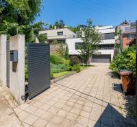 View of the family house on Sliačska Street in Bratislava - Ahoj with fencing and greenery.