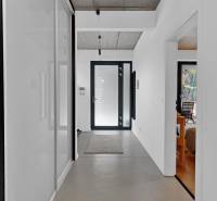 Interior of a family house with light walls, a hallway, and simple decor.
