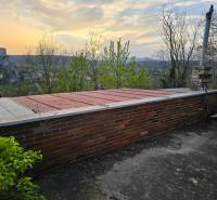 An evening view of the terrace at the cottage in Beckov at Sychrov with a view of the castle.