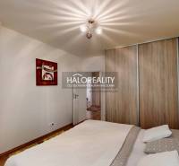 Bedroom in a 3-room apartment with a bed and a built-in wardrobe.