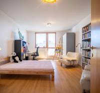 A room in a 3-room apartment contains a bed, a sofa, a bookshelf, and a desk.