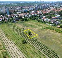 Aerial view of residential plots in Bratislava - Rača with a view of the city.