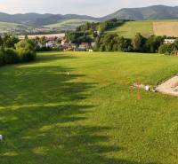 Plots - living in Kľače surrounded by greenery and hilly landscape.