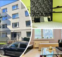 A view of a 2-room apartment with an exterior and interior including a living room and a bedroom.