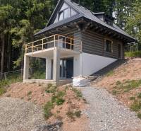 A cottage in Korňa surrounded by forest with a terrace in the middle of nature for sale.
