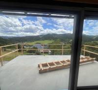 A view from the cottage in Korňa of the picturesque landscape with meadows and forests.