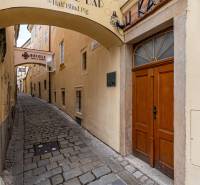 Narrow stone alley in Bratislava - Old Town on Baštová, surrounded by historic buildings.