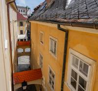 A narrow passage between historic buildings on Baštová Street in Bratislava - Old Town.