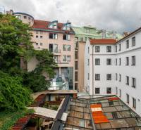 View of buildings and vegetation in the courtyard on Baštová Street, Bratislava - Old Town.