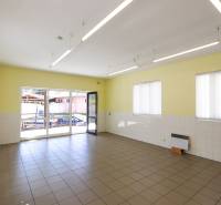 Spacious commercial spaces with large windows, tiles, and plenty of natural light.