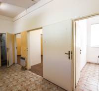 Commercial premises with multiple rooms, tiles, and white doors.