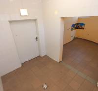 Tiled room with an opening to the adjacent section, commercial spaces with floor tiles.
