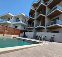 A recreational apartment in Ksamil with a pool and a large terrace for relaxation.
