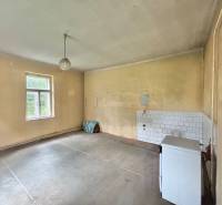 Empty room in a family house with a window and simple decoration.