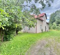 A family house on Centrum Street in Makov with a front garden and trees.