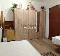 A cozy room with wooden furniture in a 2-room apartment, suitable for peaceful living.
