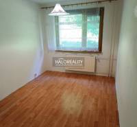 A room with laminate flooring and a large window in a 3-room apartment.