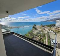 View from the terrace of a holiday apartment in the city of Sarandë overlooking the coast and the sea.