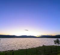 A lake at sunset, tranquil nature around Ružiná and cottages.