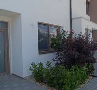 The entrance of a family house with wooden doors and a garden on Veterná Street in Galanta.