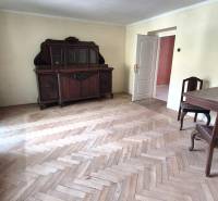Wooden furniture and parquet floors in a 3-room apartment with a retro atmosphere.