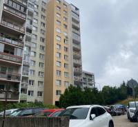 Apartment building on Rozvodná Street in Bratislava - Nové Mesto, parking lot in the foreground.