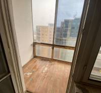 The balcony of a 3-room apartment with a view of the surrounding apartment buildings.