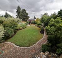 A garden at a family house on J.Š.Šikuru Street in Martin with a walkway and greenery.