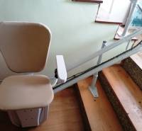 A stairlift in a family house makes it easier to move up and down the stairs.