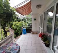 Terrace of a family house on J.Š.Šikuru Street in Martin with flowers and a table.